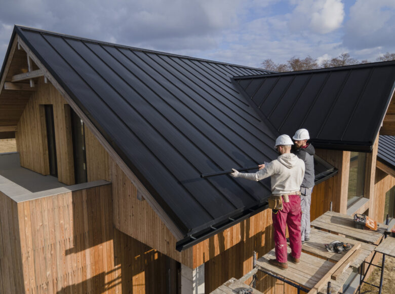 full-shot-roofers-working-together-with-helmets